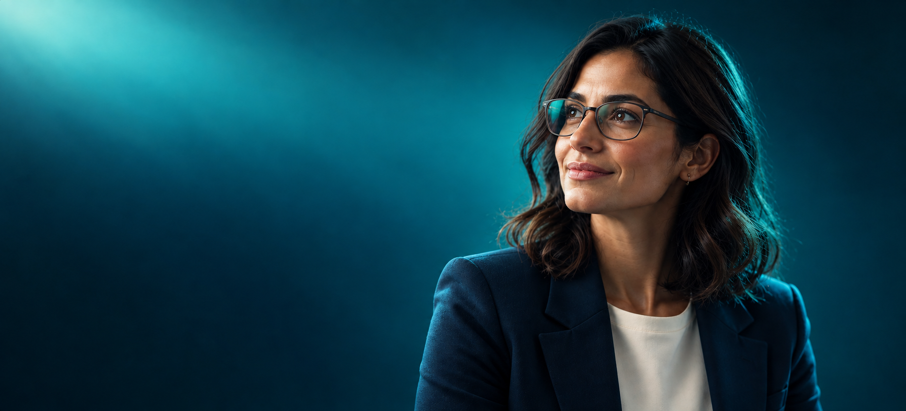 A professional looking ahead in a luminous teal environment